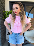 Giacca crop con fiocchi rosa