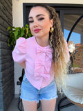 Giacca crop con fiocchi rosa