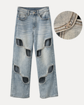 Jeans con aperture e fiocco in strass