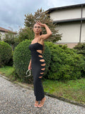 Abito in lurex nero con spacchi
