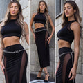 Completo top e gonna nero con trasparenze