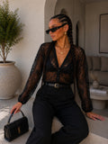 Cardigan in pizzo ricamato trasparente