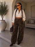 Jeans Ballon animalier con cintura e borchie