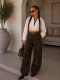 Jeans Ballon animalier con cintura e borchie