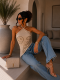 Top corsetto con borchie arabesque