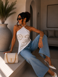 Top corsetto con borchie arabesque