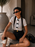 Camicia con fiocchi decorativi