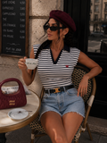 Polo smanicata a righe con colletto