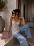 Top in pizzo floreale con bretelle