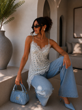 Top in pizzo floreale con bretelle