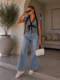 Jeans con strappi e dettaglio tasca