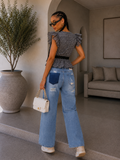 Jeans con strappi e dettaglio tasca