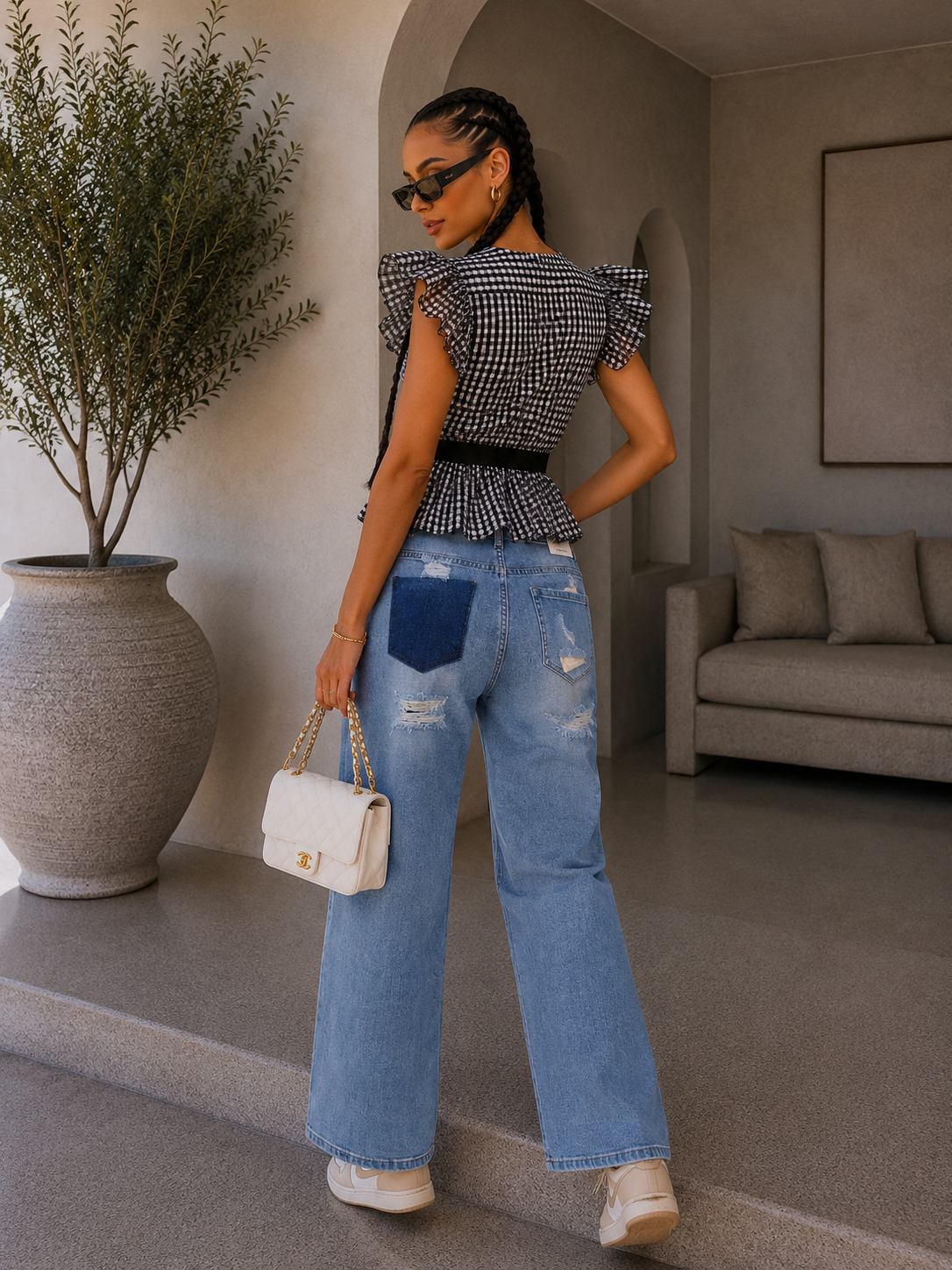 Jeans con strappi e dettaglio tasca