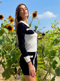 Abito in maglia aderente con bottoni