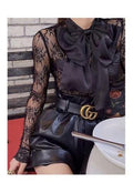 Blusa in pizzo con maxi fiocco