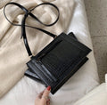 Borsa con tracolla effetto croco