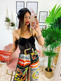 Pantalone a zampa stampa etnica Base Arancio
