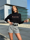 Pull nero e rosa