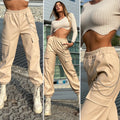 Pantalone in ecopelle con catenina beige