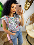 Maglia con spalline bombate e unicorni