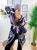 Cardigan lilla con frange e cinta