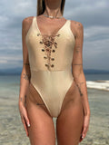Body intero gold con anelli e lacci
