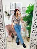 Blusa floreale con fiocco