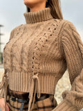 Maglione beige con trecce