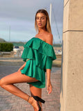 Tutina verde scollo a barchetta e balze