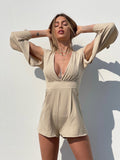 Tutina beige con fiocchetti