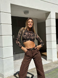 Top nude ricami nero