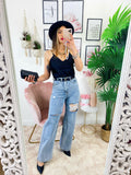 Jeans boyfriend zampa larga con maxi spacchi