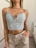 Top in pizzo con perle celeste