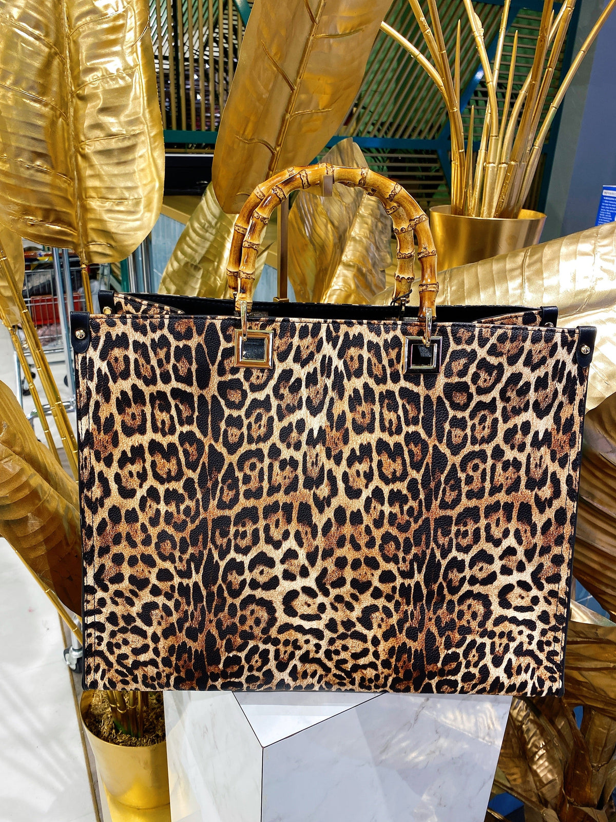 Maxi bag maculata con manico in legno