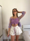 Short bianco a farfalla con strappini