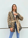 Cardigan con frange a rombi nude