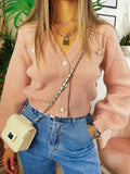 Maglione con bottoni gioiello a cuore rosa
