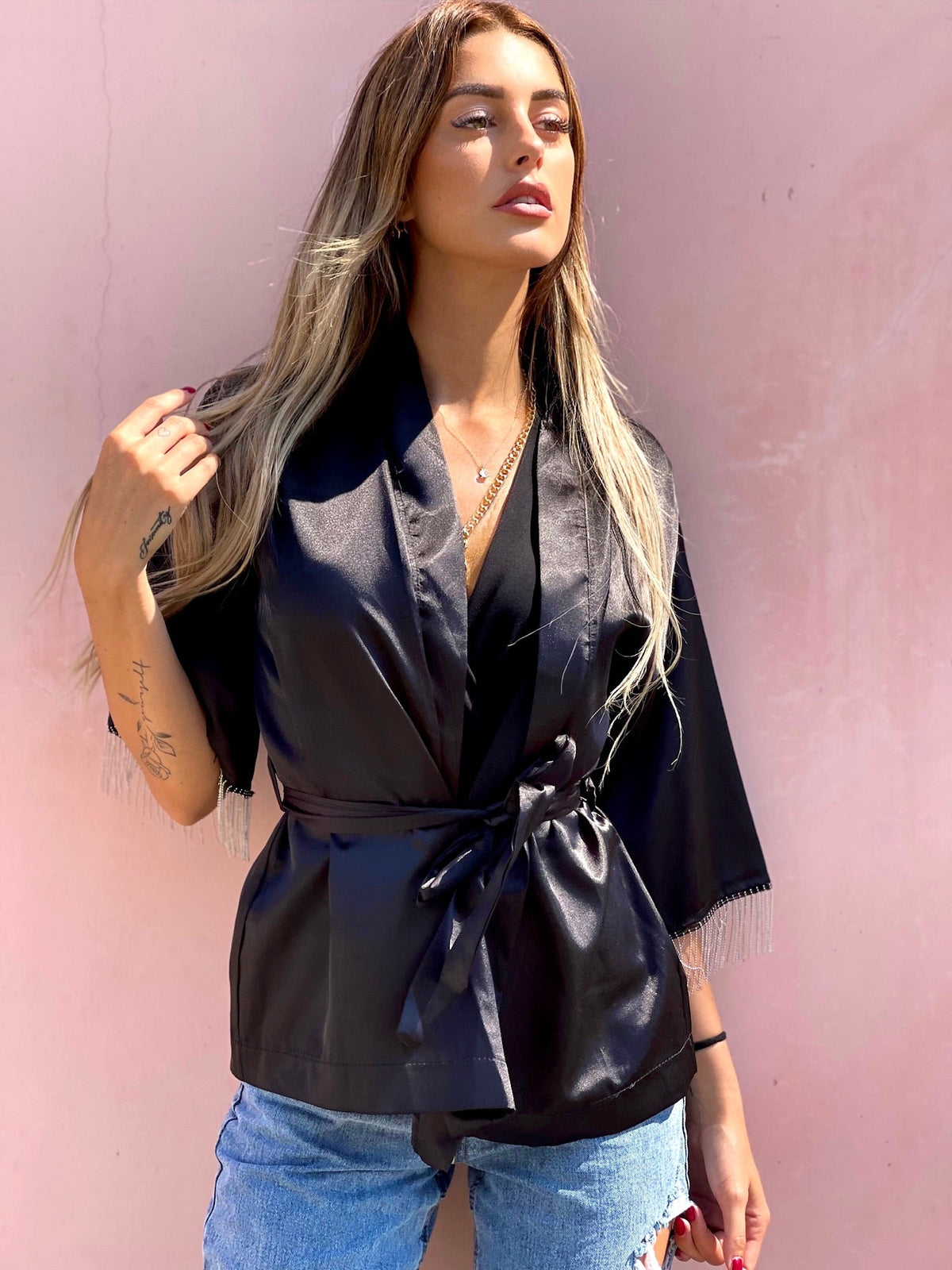 Blusa o kimono con frange