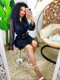 Abito a balze nero con glitter argento