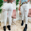 Jeans bianco con strappo sul lato B