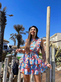 Abito a fiori azzurro schiena aperta