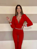 Tuta rossa schiena aperta e strass