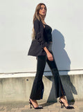 Pantalone in ecopelle con spacco