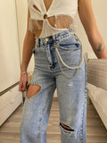 Jeans con cuore e strass