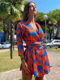 Abito arancio fiori azzurri