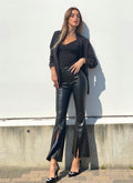 Pantalone in ecopelle con spacco