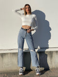 Jeans wide leg con strappi e dettaglio