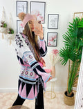 Cardigan rosa con frange e cinta