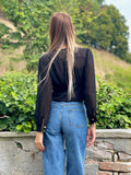 Blusa nera bottoncini oro