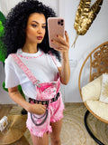 Salopette in jeans rosa sfrangiata